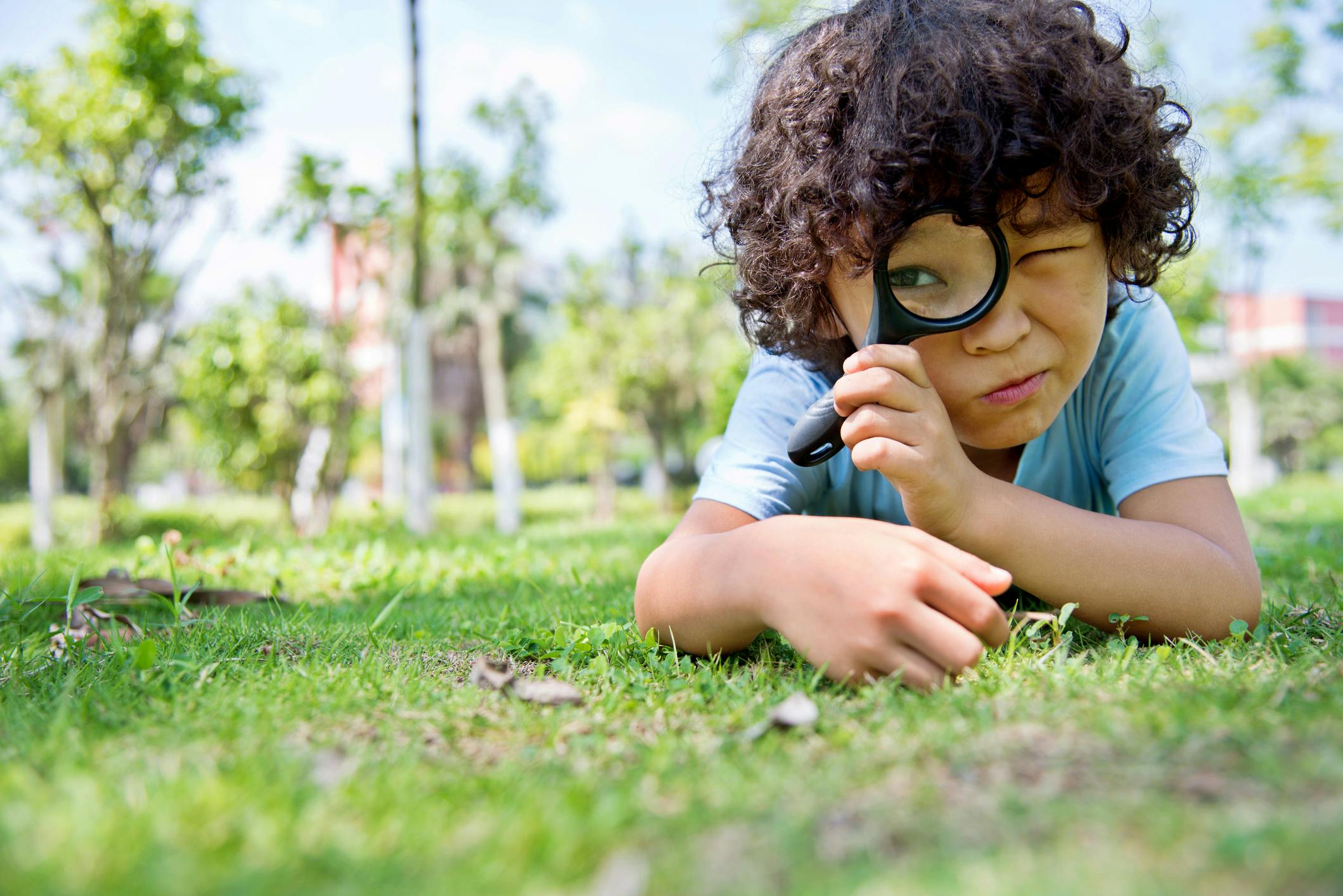 Boy with magnifying glass