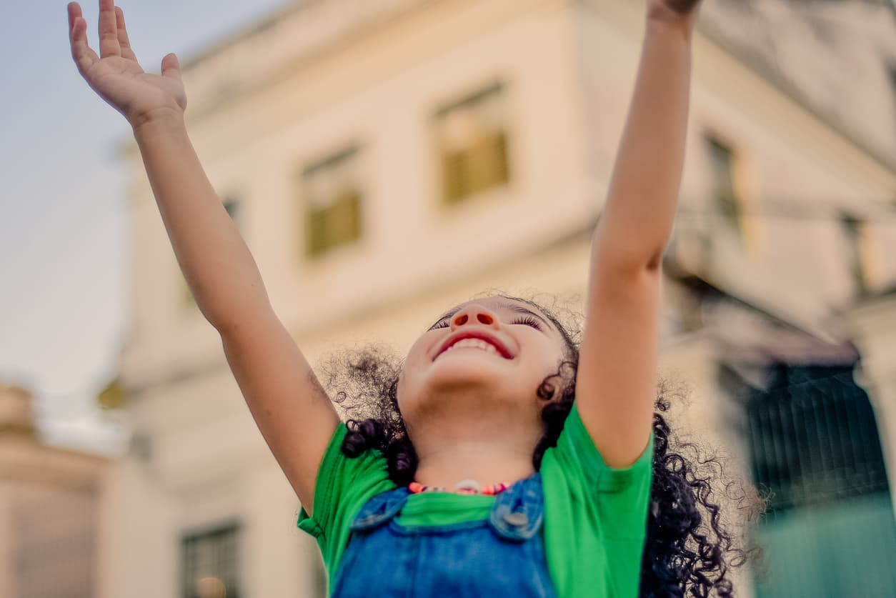 Brazilian girl arms in the air