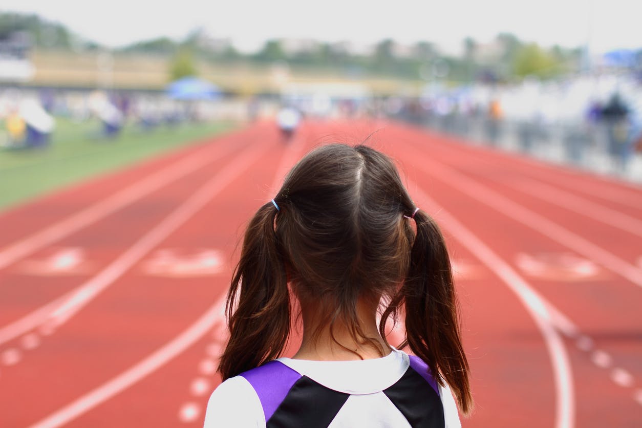 Girl with racetrack ahead