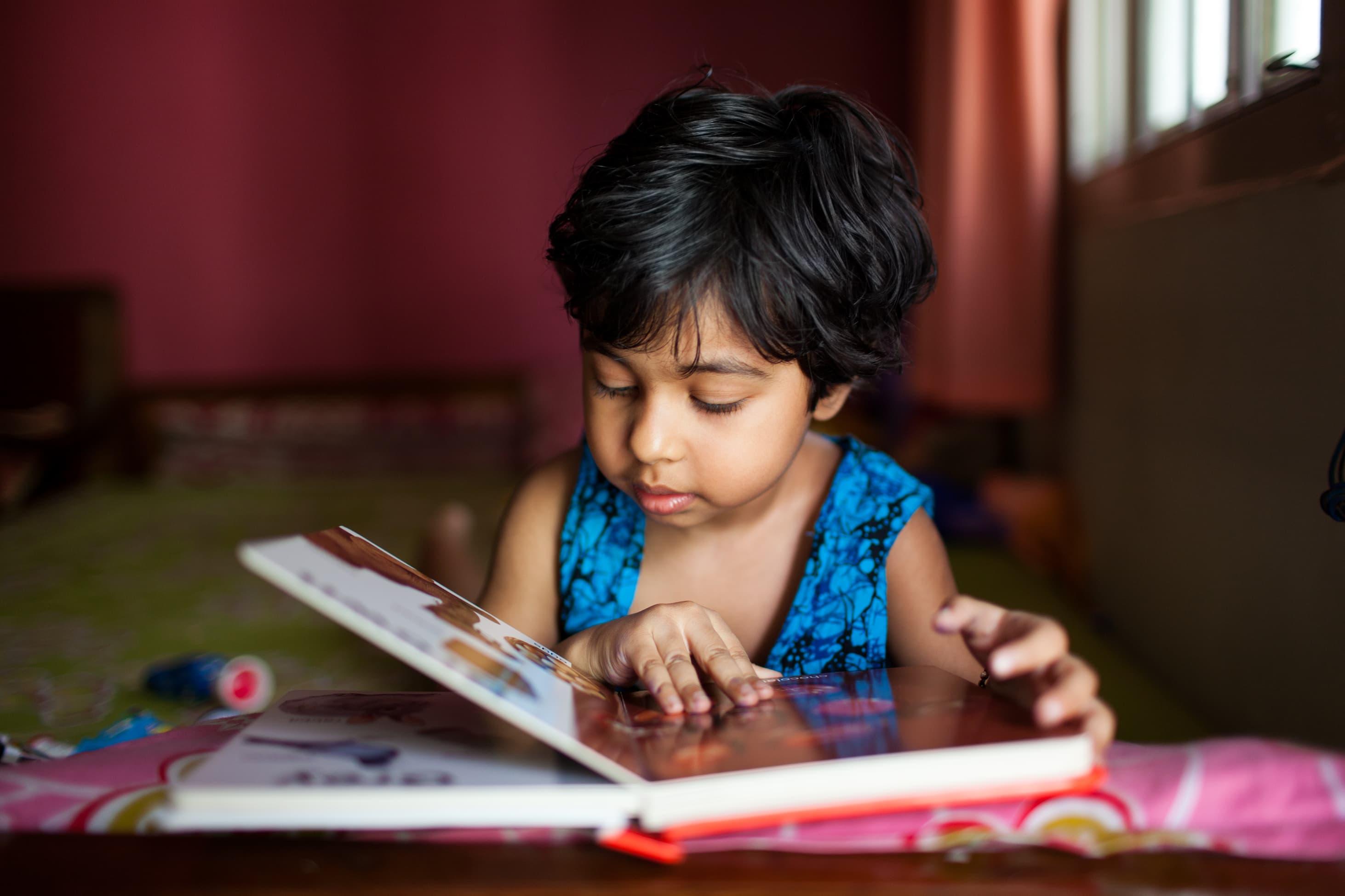 Young girl reading book